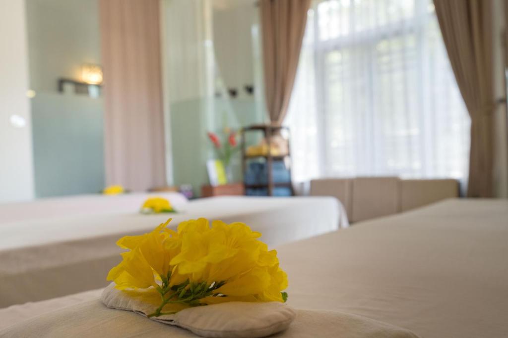 Postel nebo postele na pokoji v ubytování East West Villa