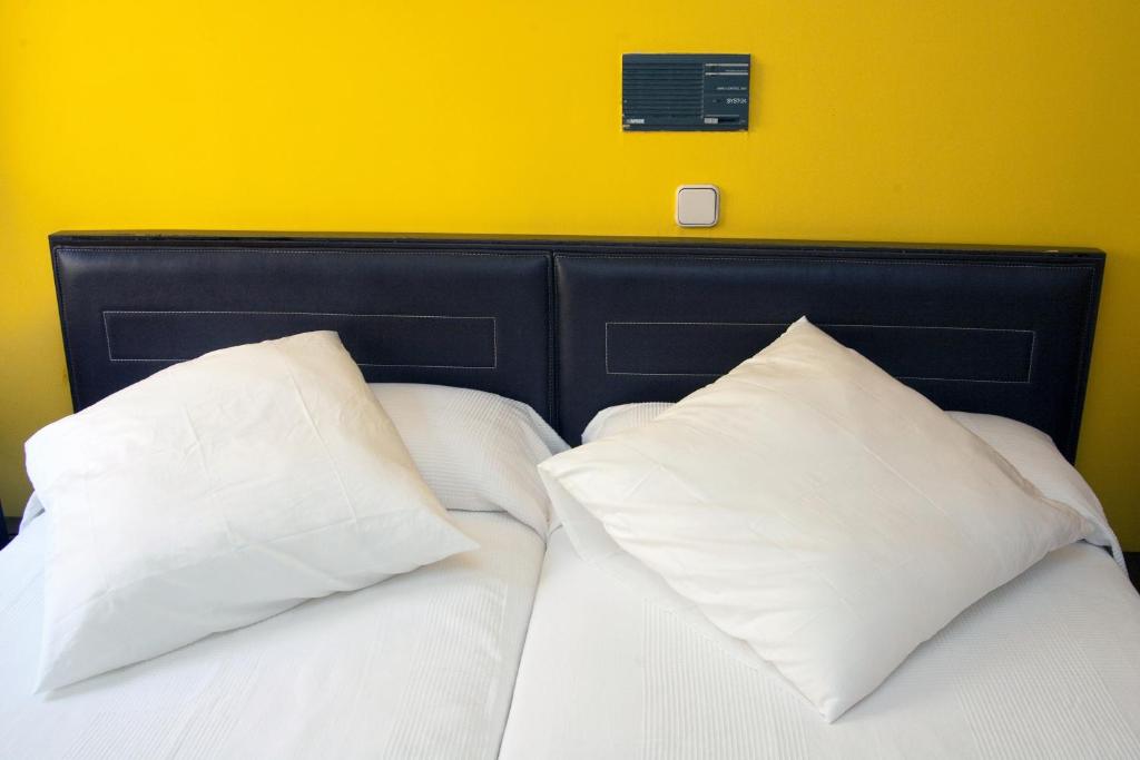 Postel nebo postele na pokoji v ubytování Gran Hostal San Segundo