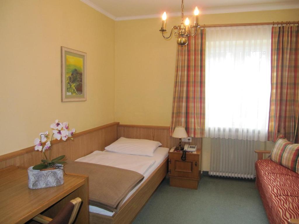 Postel nebo postele na pokoji v ubytování Goldener Ochs