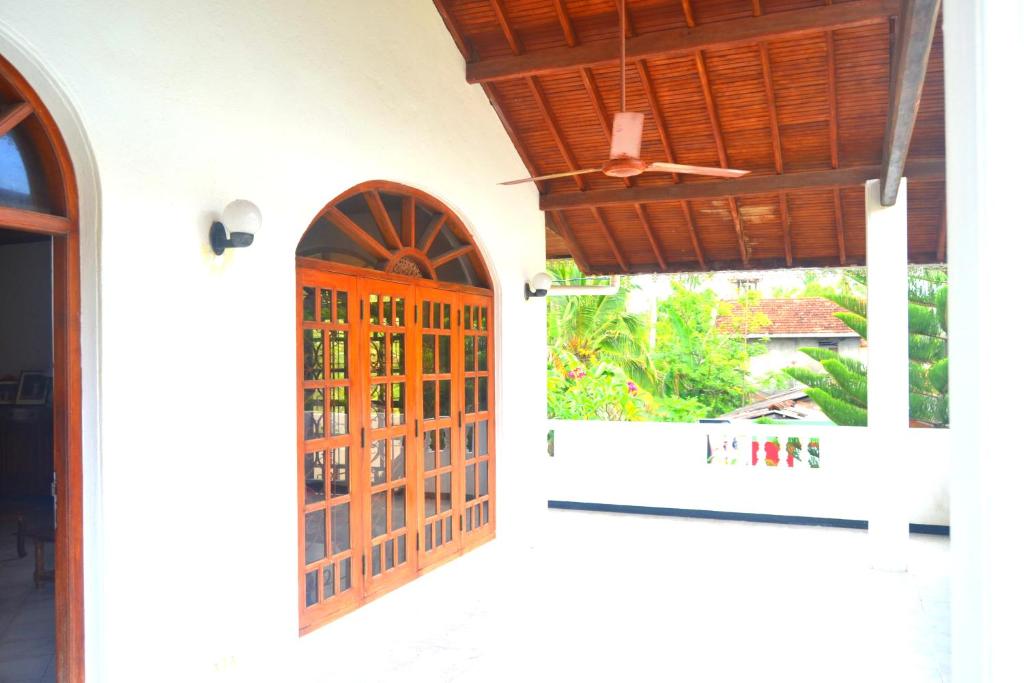 an open door of a house with a window at Chaya Villa Guest House in Beruwala