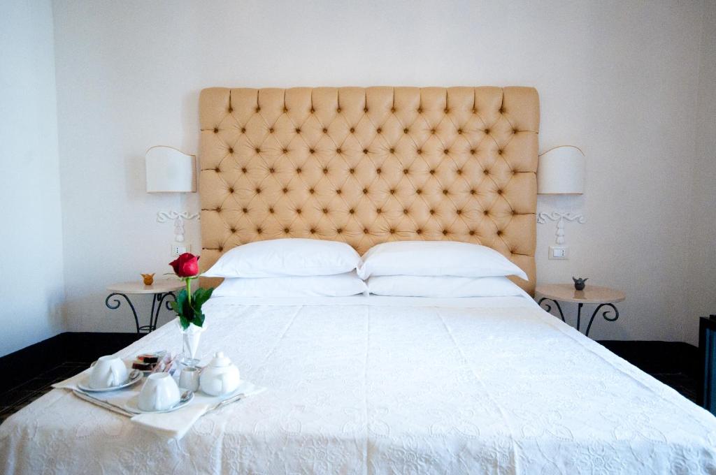 Postel nebo postele na pokoji v ubytování Sveva rooms