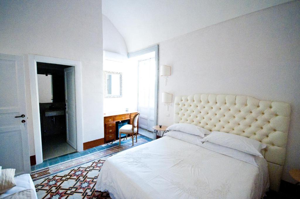Postel nebo postele na pokoji v ubytování Sveva rooms
