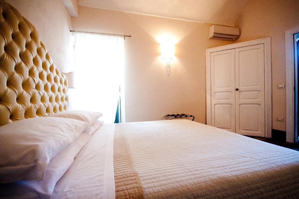 Postel nebo postele na pokoji v ubytování Sveva rooms