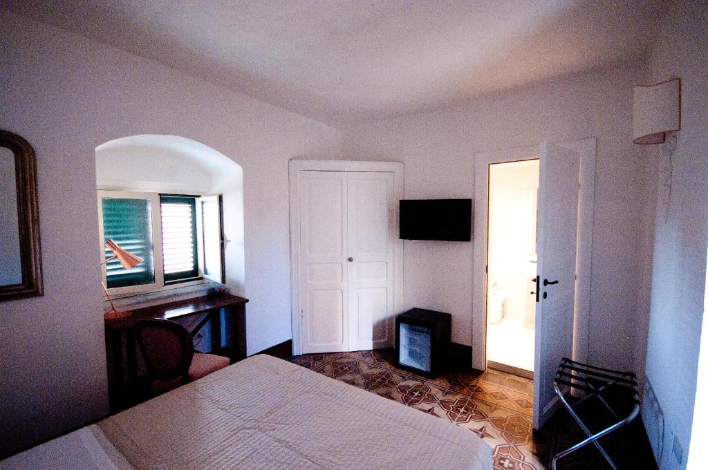 Postel nebo postele na pokoji v ubytování Sveva rooms