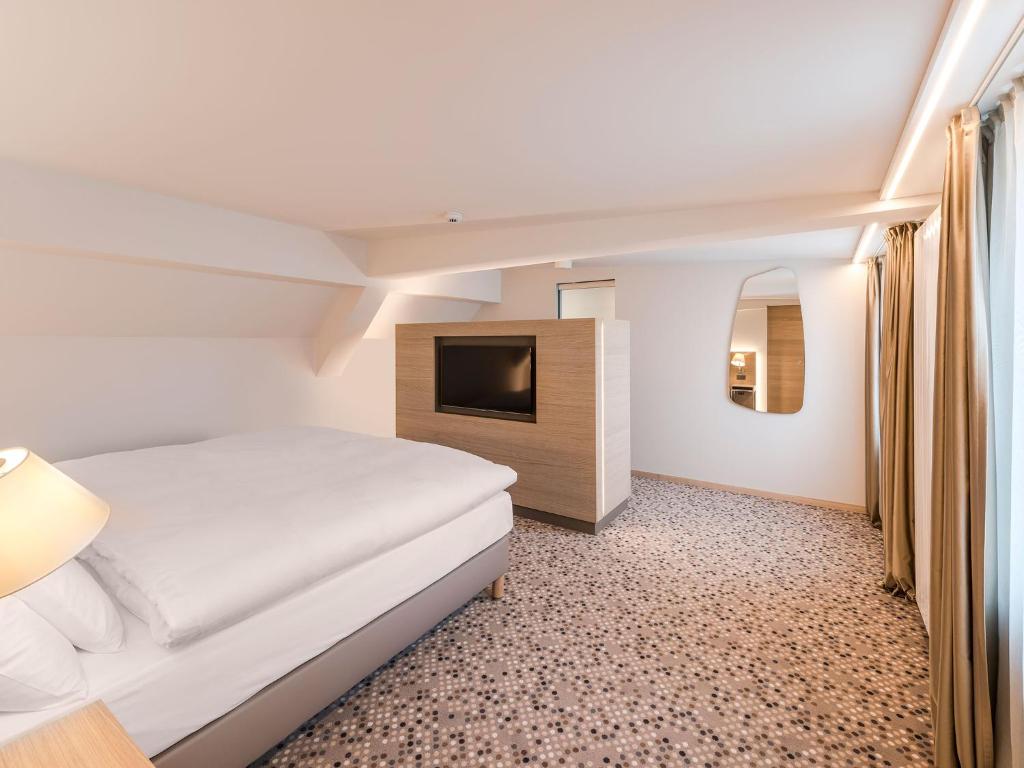 Postel nebo postele na pokoji v ubytování Hotel Savoy