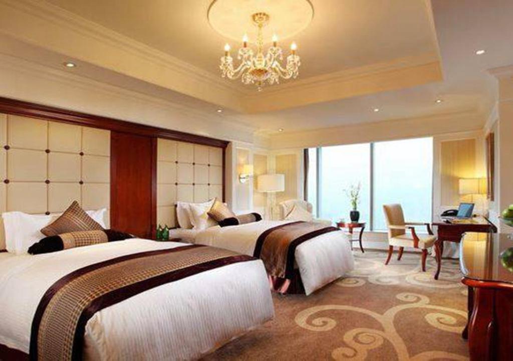 Postel nebo postele na pokoji v ubytování Kempinski Hotel Guiyang