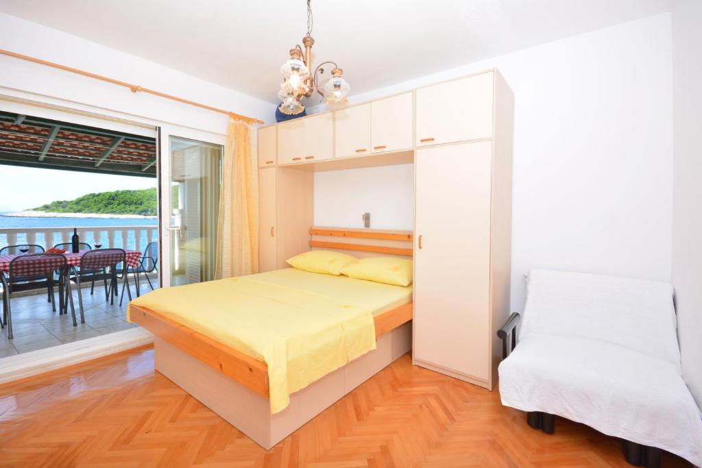 Postel nebo postele na pokoji v ubytování Apartments Regina