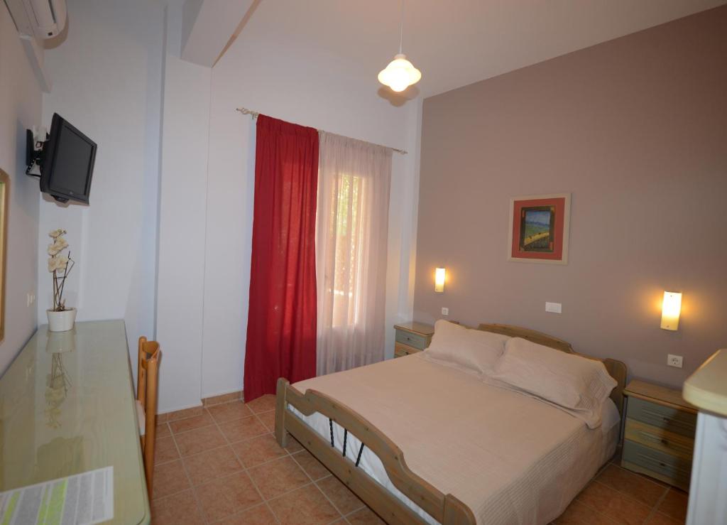 A bed or beds in a room at Konstantza Studios and Apartments