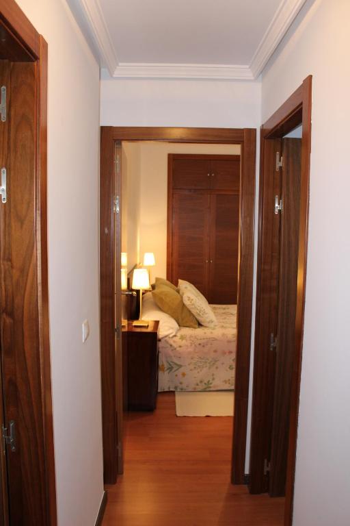Posteľ alebo postele v izbe v ubytovaní Apartamentos Balcón de la Vega