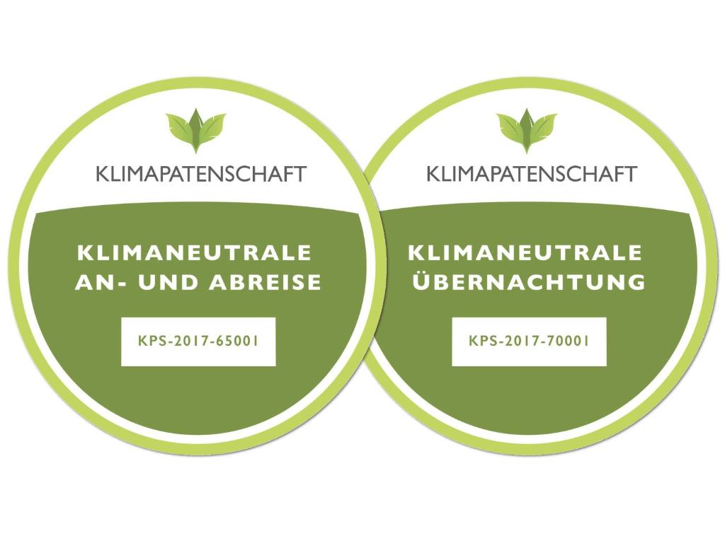 two circles with the text kimplement pesticide an unvaccinated alternative at Ferienhaus Scout 42 im Feriendorf in Bachenbrock