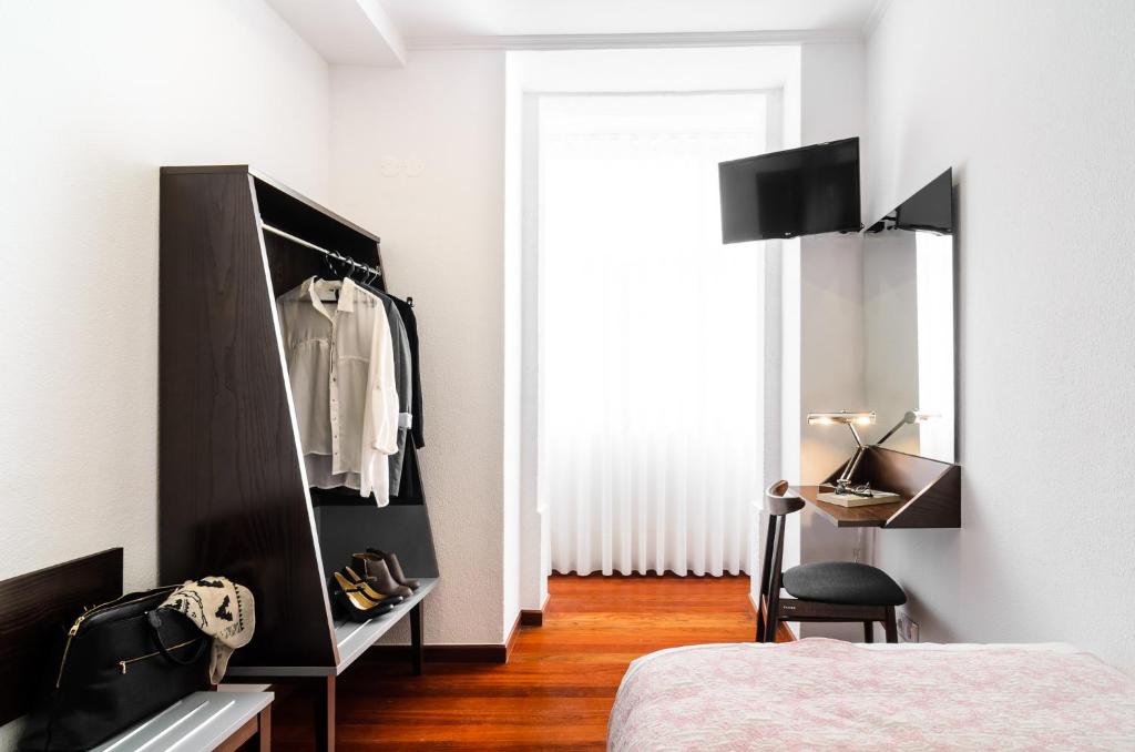 TV a/nebo společenská místnost v ubytování Hotel Portuense Lisboa