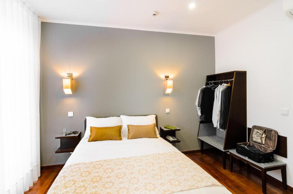 Postel nebo postele na pokoji v ubytování Hotel Portuense Lisboa