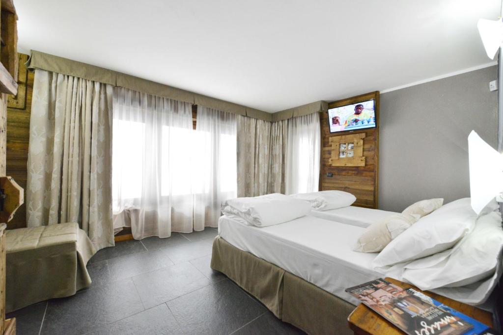 Łóżko lub łóżka w pokoju w obiekcie Mollino Rooms