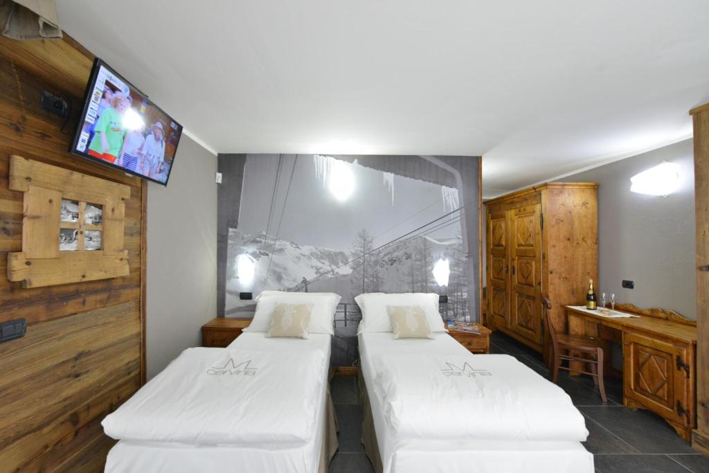 Łóżko lub łóżka w pokoju w obiekcie Mollino Rooms
