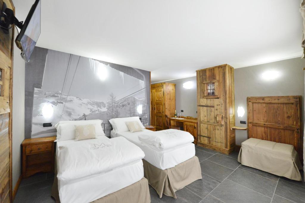 Łóżko lub łóżka w pokoju w obiekcie Mollino Rooms