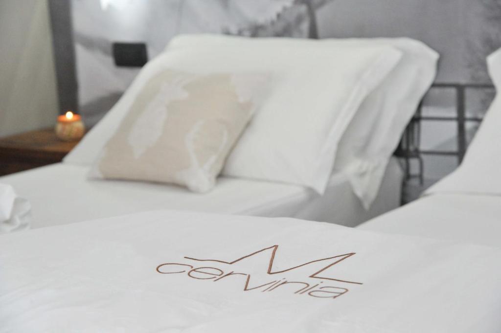 Łóżko lub łóżka w pokoju w obiekcie Mollino Rooms