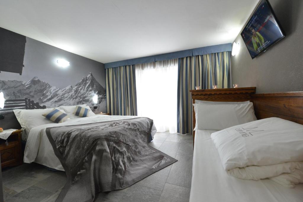 Łóżko lub łóżka w pokoju w obiekcie Mollino Rooms