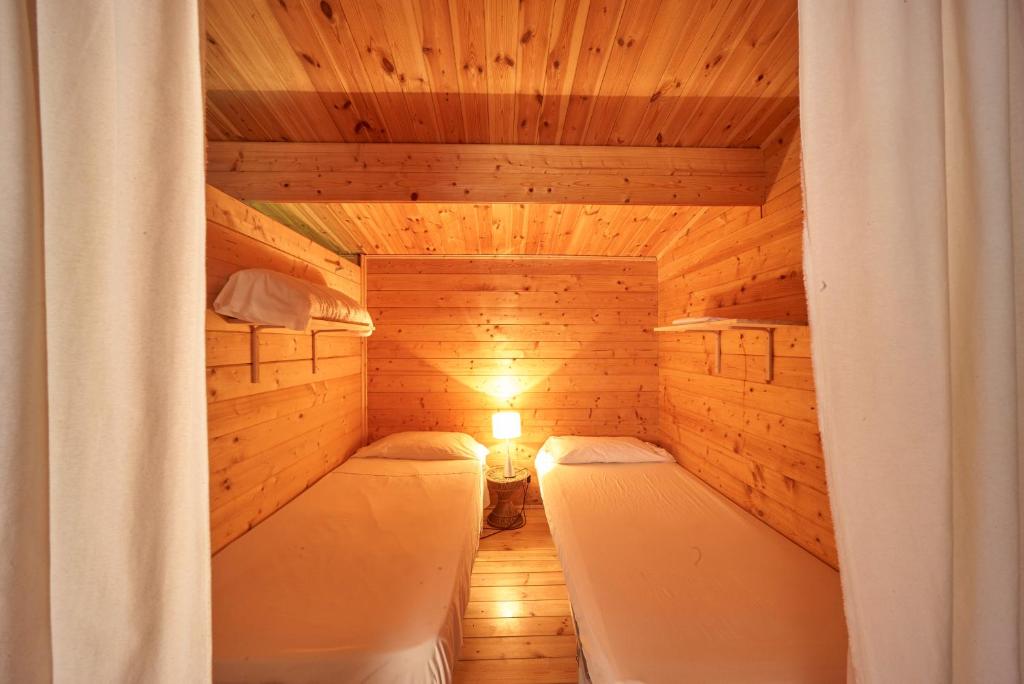 Postel nebo postele na pokoji v ubytování Camping Escana
