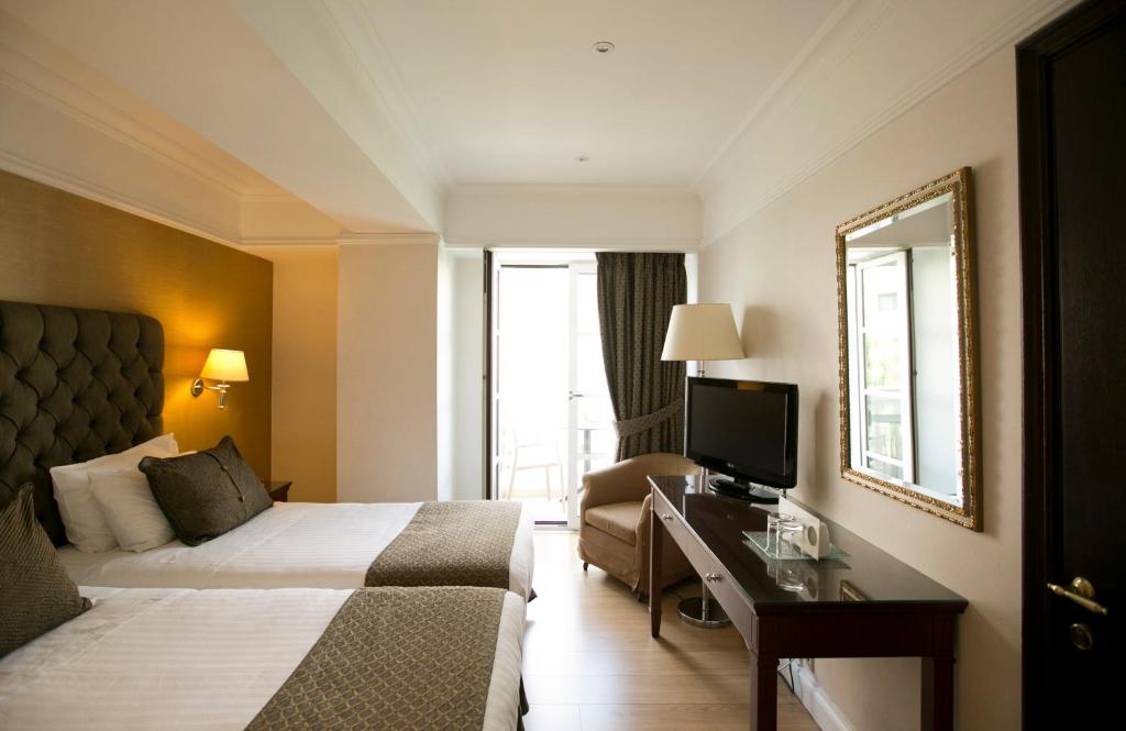 Postel nebo postele na pokoji v ubytování Hera Hotel