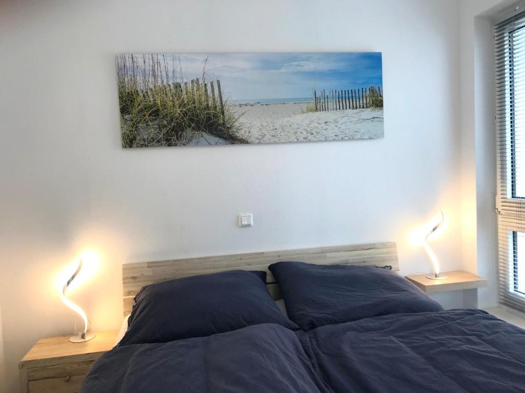 Postel nebo postele na pokoji v ubytování Apartment Warnemünde 11