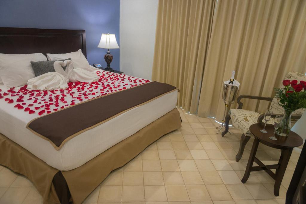 Una cama o camas en una habitación de Hotel Presidente Las Tablas
