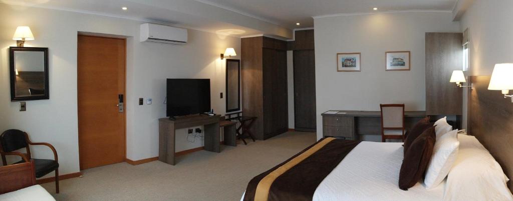 TV a/nebo společenská místnost v ubytování Conrado Hotel Osorno