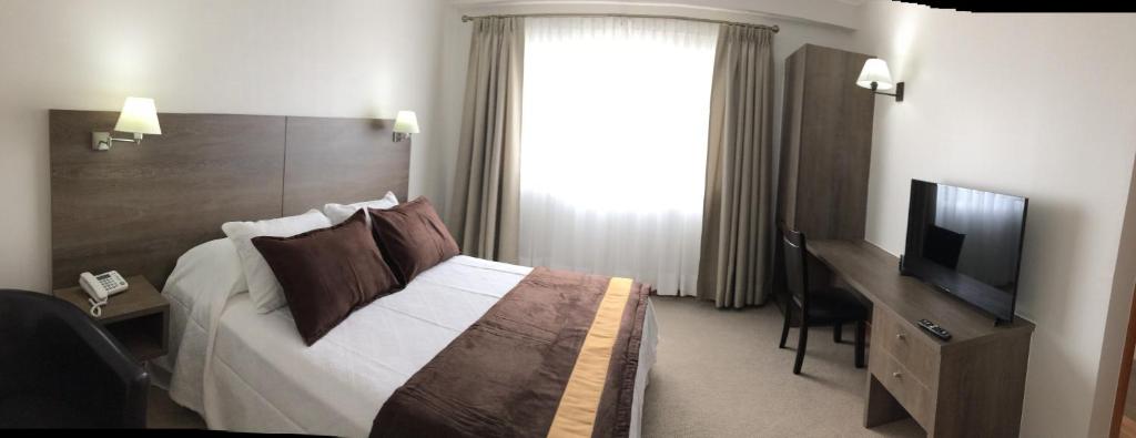 TV a/nebo společenská místnost v ubytování Conrado Hotel Osorno