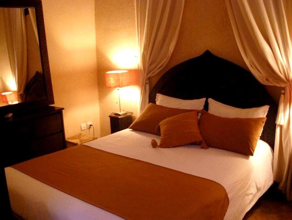 Postel nebo postele na pokoji v ubytování Riad Aderbaz