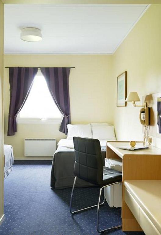 Postel nebo postele na pokoji v ubytování Hotel Surte
