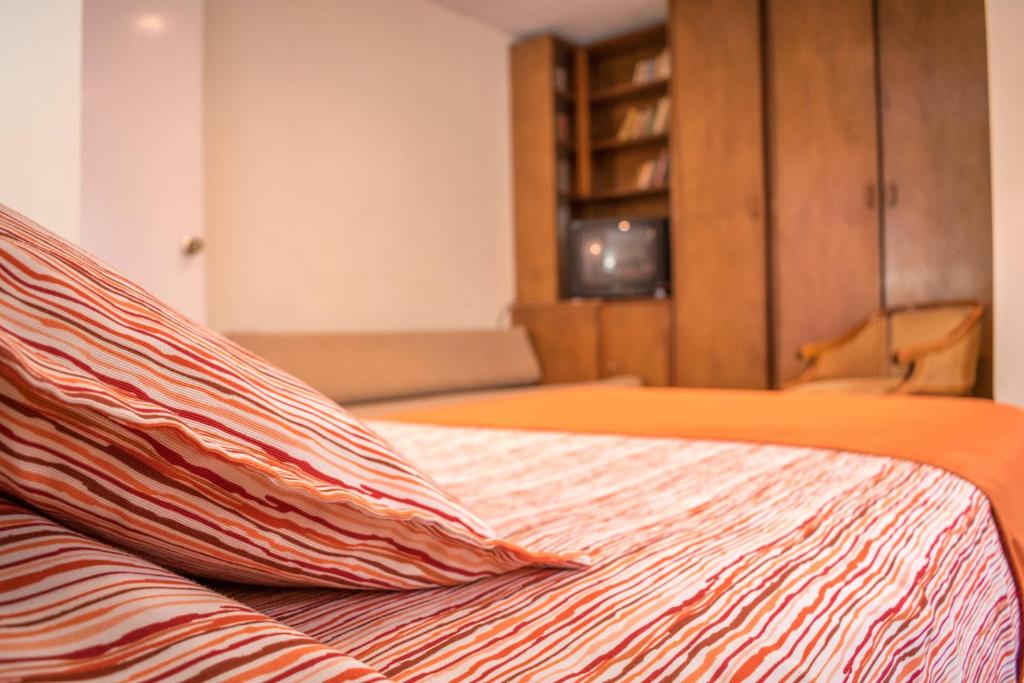 Postel nebo postele na pokoji v ubytování GHL casa hotel