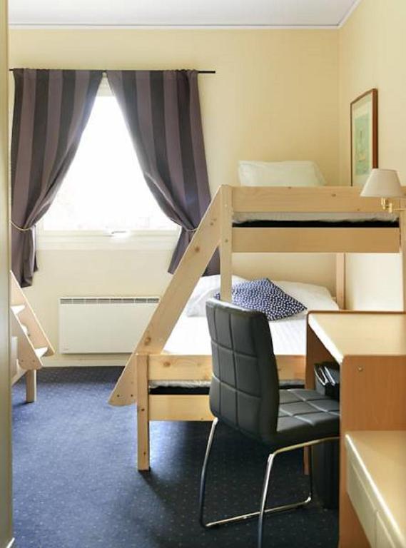 Postel nebo postele na pokoji v ubytování Hotel Surte