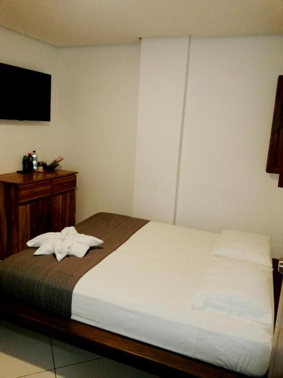 Postel nebo postele na pokoji v ubytování Hotel Bahia Guatape