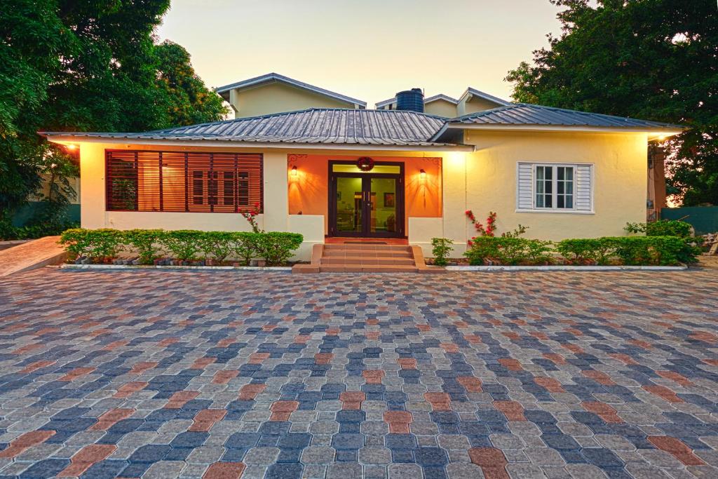 a house with a brick driveway in front of it at Shirley Retreat in Kingston