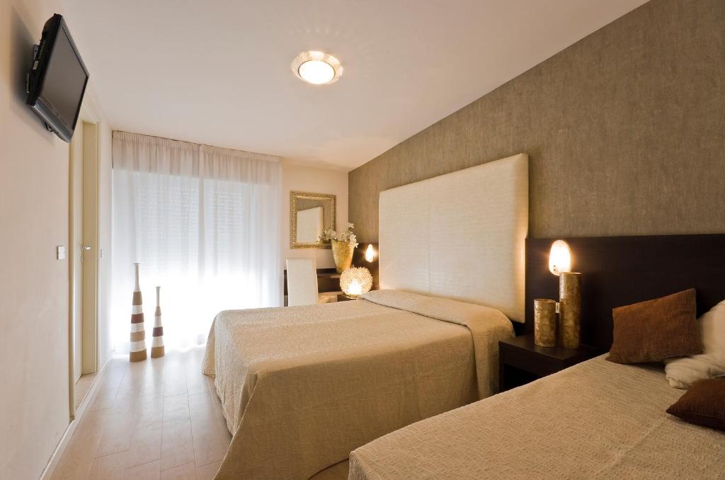 Postel nebo postele na pokoji v ubytování Hotel Foschi-Peninsula