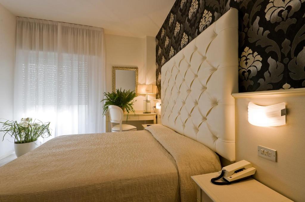 Postel nebo postele na pokoji v ubytování Hotel Foschi-Peninsula