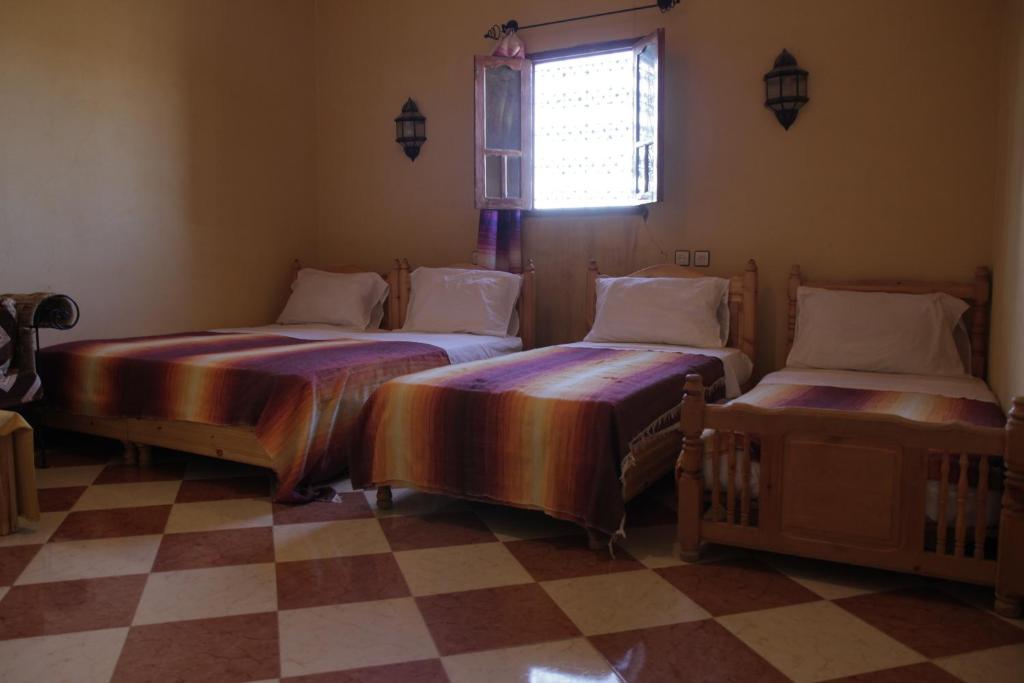 Postel nebo postele na pokoji v ubytování Auberge La Source