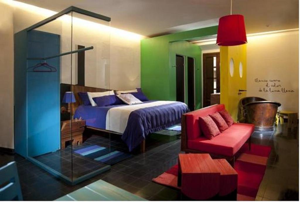 Postel nebo postele na pokoji v ubytování Del Carmen Concept Hotel Boutique by Chai