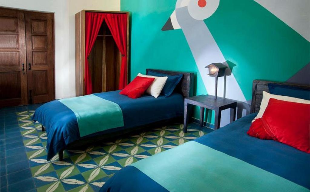 Postel nebo postele na pokoji v ubytování Del Carmen Concept Hotel Boutique by Chai