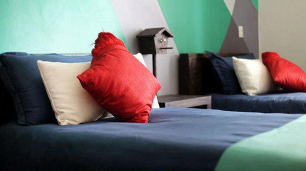 Postel nebo postele na pokoji v ubytování Del Carmen Concept Hotel Boutique by Chai
