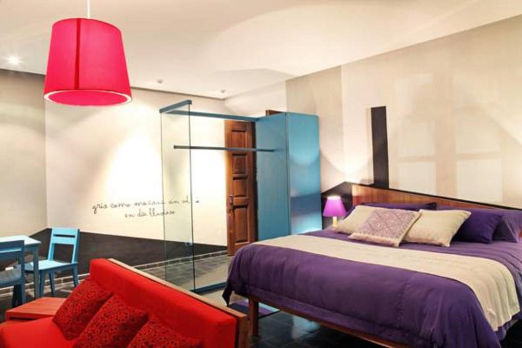 Postel nebo postele na pokoji v ubytování Del Carmen Concept Hotel Boutique by Chai