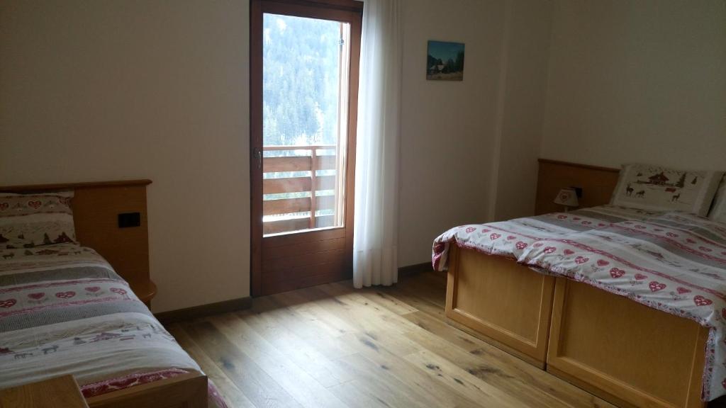 Postel nebo postele na pokoji v ubytování Meublè Rosalpina