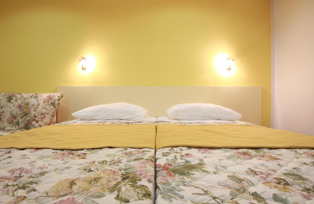 Postel nebo postele na pokoji v ubytování Hotel Sali
