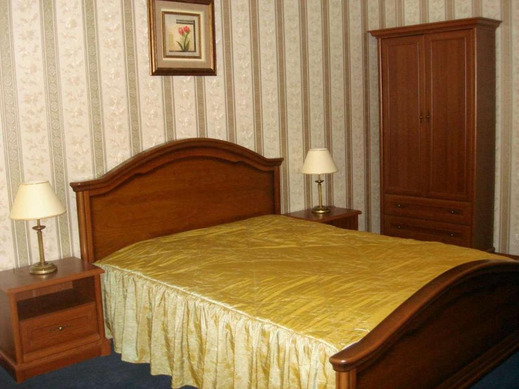 Postel nebo postele na pokoji v ubytování Diplomat ApartHotel