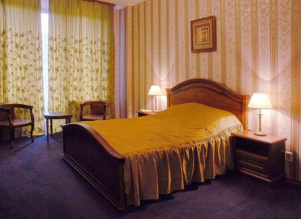 Postel nebo postele na pokoji v ubytování Diplomat ApartHotel