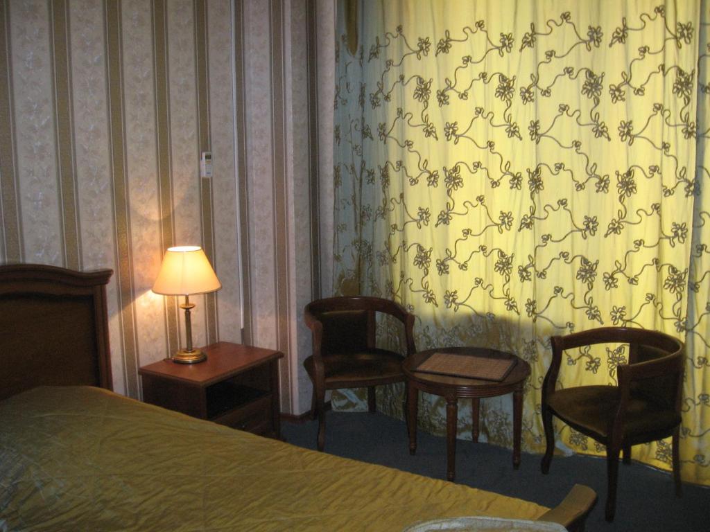 Postel nebo postele na pokoji v ubytování Diplomat ApartHotel