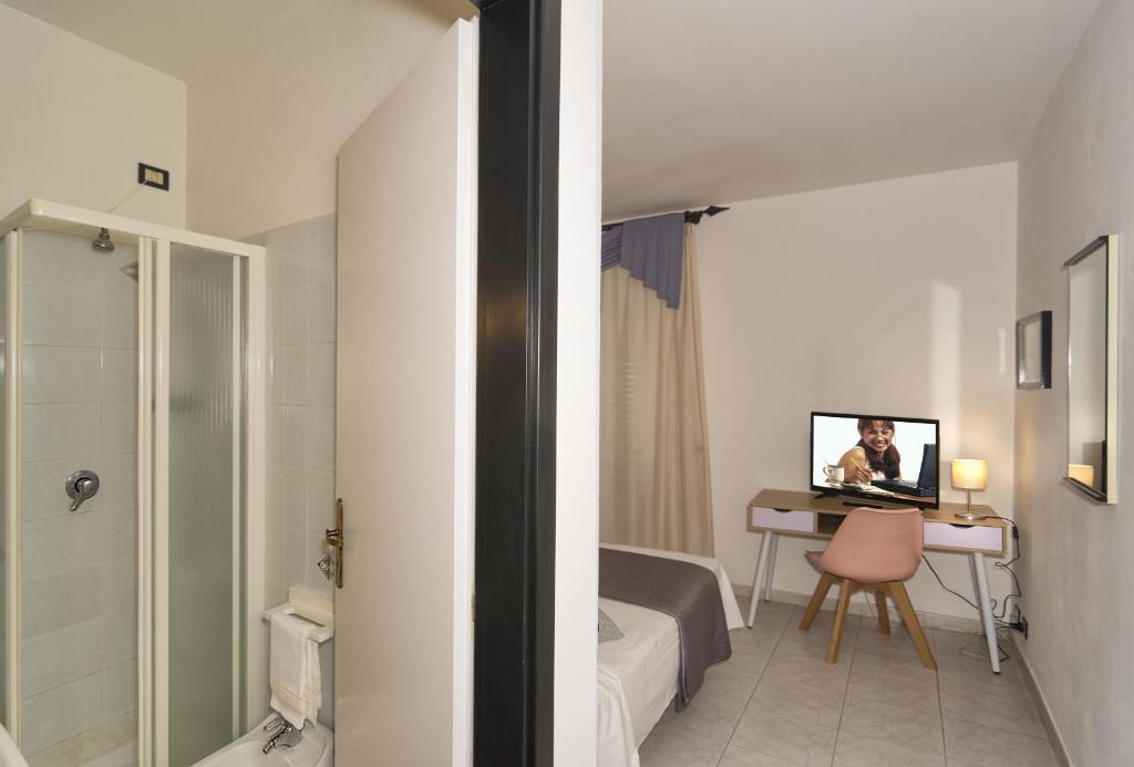 TV a/nebo společenská místnost v ubytování Hotel Amalfitana
