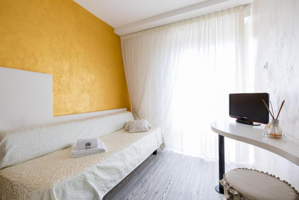 Postel nebo postele na pokoji v ubytování Hotel Ca' Di Valle