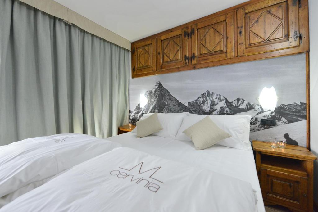 Łóżko lub łóżka w pokoju w obiekcie Mollino Rooms