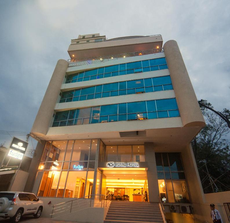 a building with a car parked in front of it at NS Royal Hotel in Cebu City