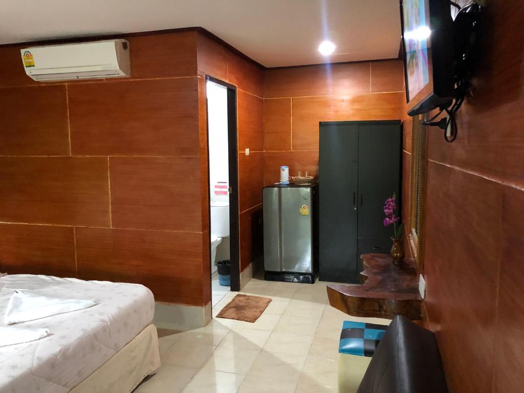 Postel nebo postele na pokoji v ubytování Ruan Mai San Ngam Resort - SHA Plus